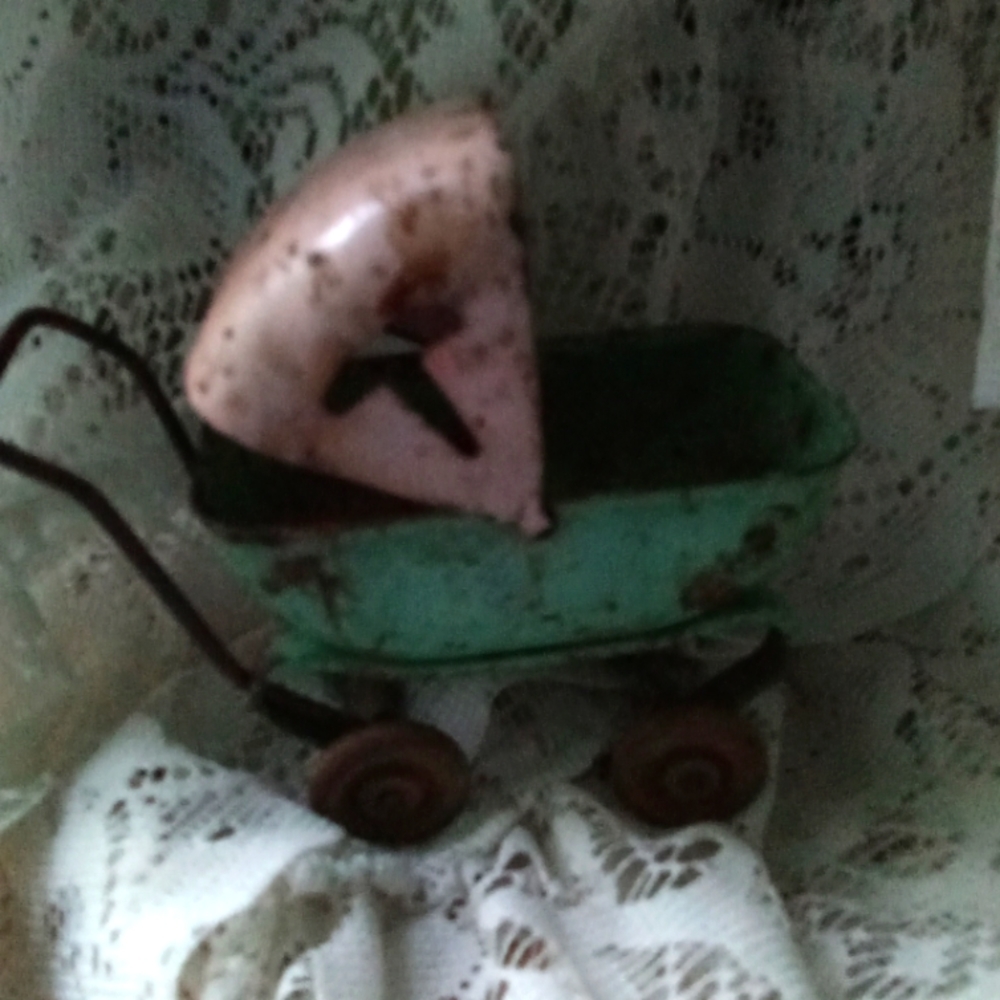 Antique Minature baby buggy toy from the 1920's